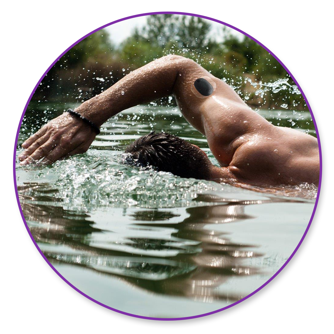 Person swimming freestyle in a natural body of water, wearing a wristband and CGM smart transmitter